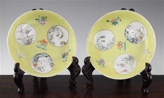 A pair of Chinese yellow ground famille rose medallion dishes, 19th century, 19cm, ground off glaze to base